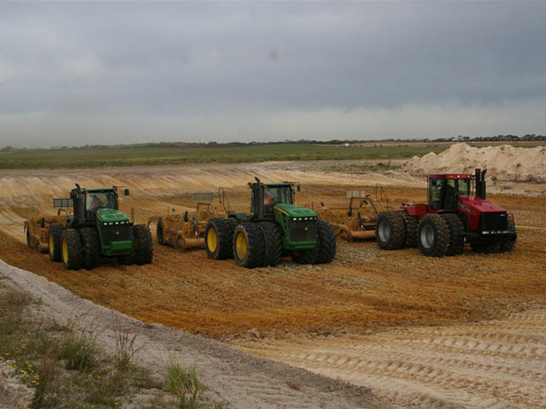  Three 4WD Tractor and Landplanes excavating clay